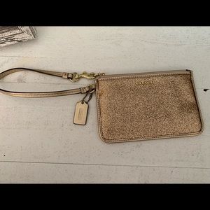 Gold coach wristlet